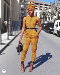 African girl in ankara jumpsuit with matching headwrap