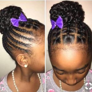 Little black girl with a unique cornrow style leading to a braided updo