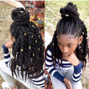 Little girl with twisted braids styled in the half up half down updo