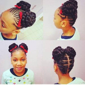 Little black girl with cornrows in front and stitch braids at the back, leading to two braided buns in the middle