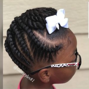 Little black girl with her natural hair braided into chunky flat twists