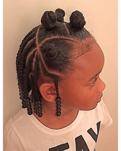 Little black girl with natural hair braided and twisted into Bantu knots