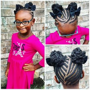 Little black girl with cornrows leading to two braided buns, adorned with hair bows