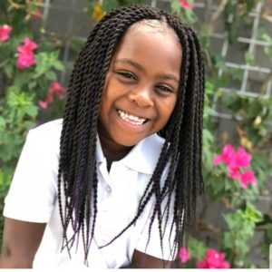 Little black girl with classic twisted braids