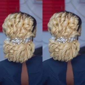 curly blonde wedding hairstyle, low bun with wedding hair piece