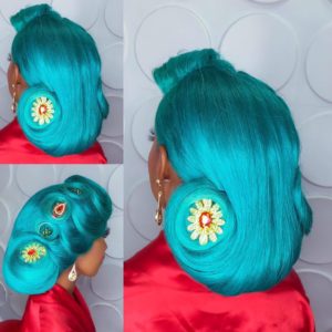turquoise coloured wedding hairstyle with floral wedding hair accessories