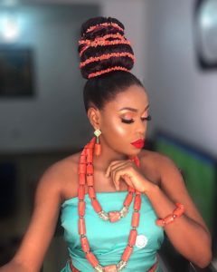 hairstyle with coral accessories for traditional wedding