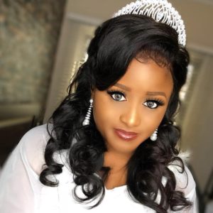 curly wedding hair down with tiara and bridal accessorie
