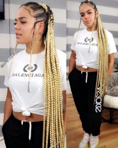 woman wearing extra-long blonde fulani braids box braids hairstyle
