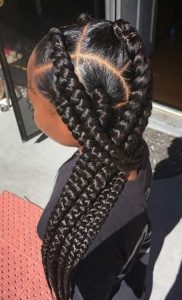 black girl wearing jumbo box braids style