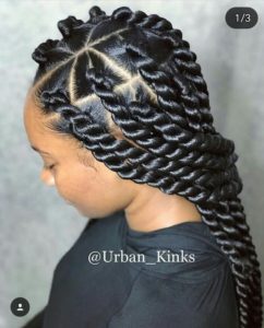 black girl wearing jumbo twists on triangle parts box braids hairstyle