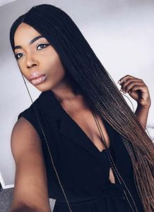 black girl wearing cute ombre microbraids style