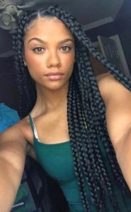 black girl wearing jumbo box braids style
