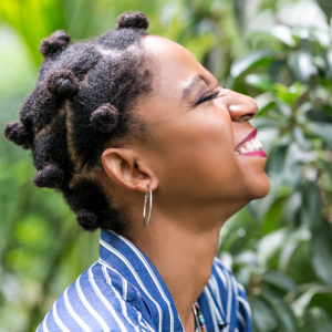 Black woman with bantu knot style on 4c hair