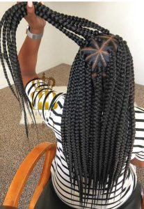 black woman wearing box braids with triangular parts, braided hairstyles for black hair