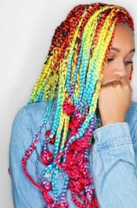 black girl wearing bright coloured box braids hairstyle