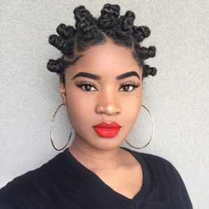 black girl wearing her hair in cute midi bantu knots