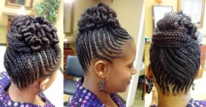 black woman wearing cornrows twisted into an updo