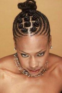 black lady with cornrows and little bantu knots on top