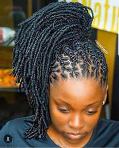 black girl with neatly twisted locs gathering upward, black braided hairstyles