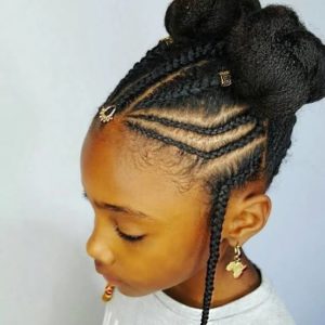 litle girl with cute cornrow braids and two stylish bantu knots