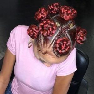 woman with beautiful red bantu knots hairstyle