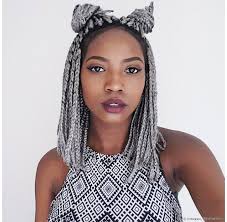 black girl in grey bob box braids, with top part twisted into two bantu knots