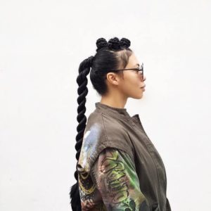 Girl twisted ponytail and braided bantu knots on top