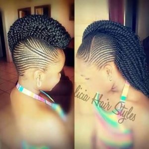 woman with beautiful tiny cornrows leading to a braided mohawk