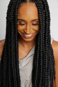 black woman wearing long box braids