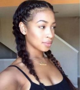 black girl wearing braided pigtails
