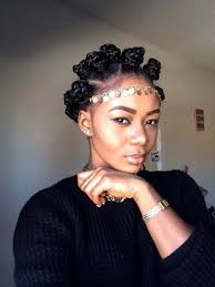 black woman with bantu knots and golden hair accessory