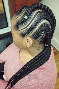 black girl wearing curvy stitch braids