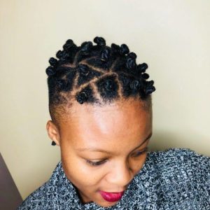 black woman with mohawk twisted into bantu knots