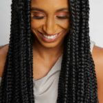 black woman wearing long box braids