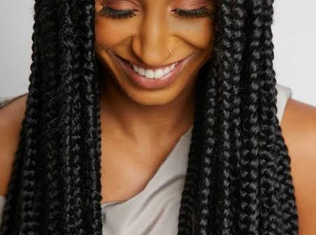 black woman wearing long box braids